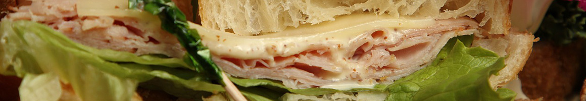Eating Sandwich at Lake Anne Coffee House & Wine Bar restaurant in Reston, VA.